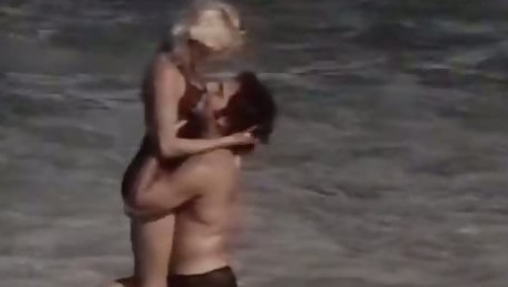 Ginger Lynn Allen is having passionate sex on a beach with a hairy dude